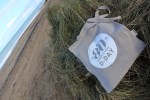 dada tote bag on the beach